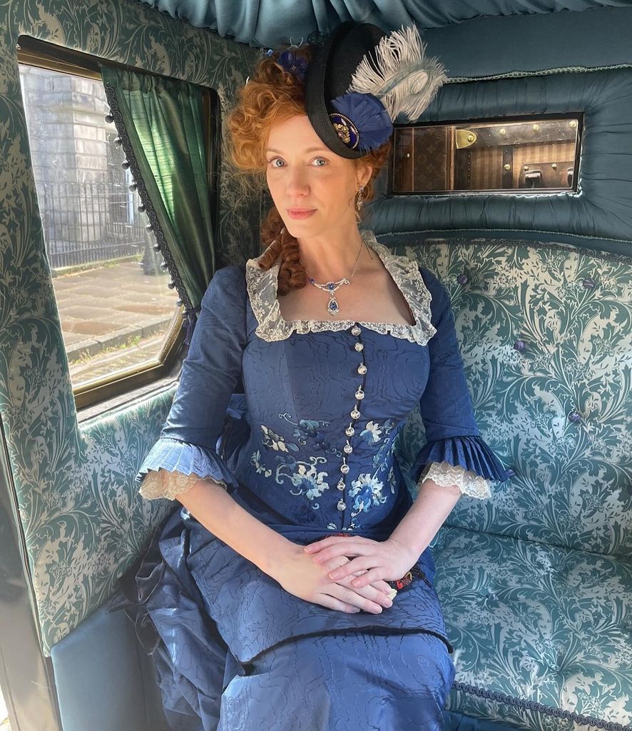 Christina Hendricks barely contains herself in tiny corset in jaw(01)