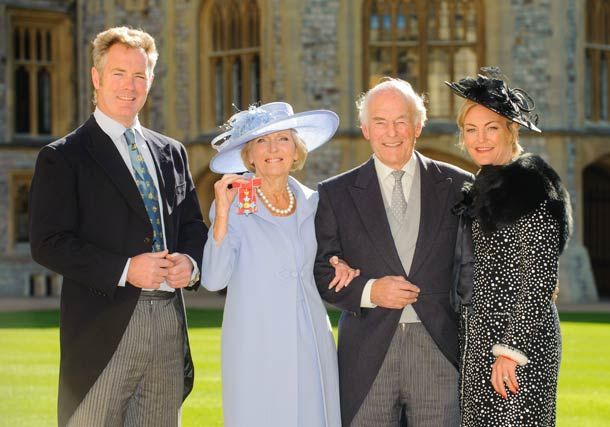 Mary collecting her CBE in 2012 with husband Paul and children Tom and Annabel