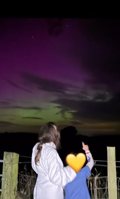 Cheryl and son Bear on holiday in Cumbria looking at the Northern Lights