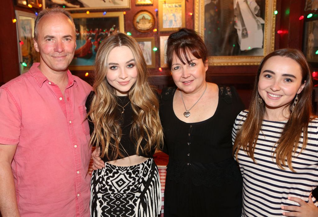 Sabrina Carpenter poses with her family as she promotes her Hollywood Record's CD "Eyes Wide Open" and her Disney TV show "Girl Meets World" at Buca di Beppo Times Square on June 7, 2015 in New York City
