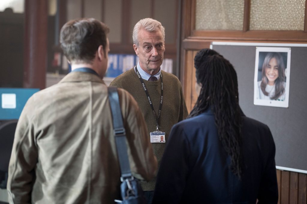 three detectives in police station
