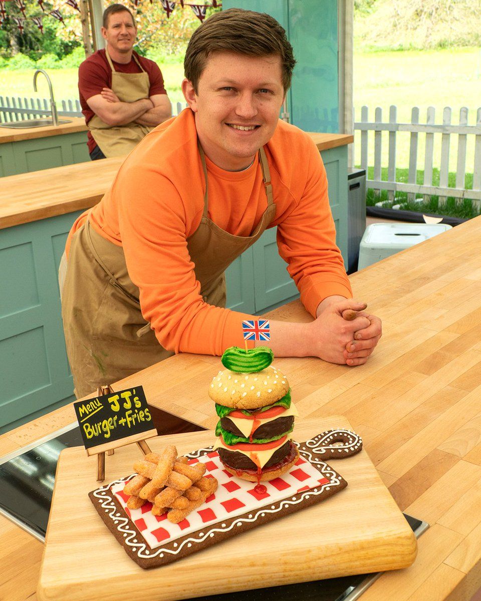 Josh with his illusion biscuit on Bake Off