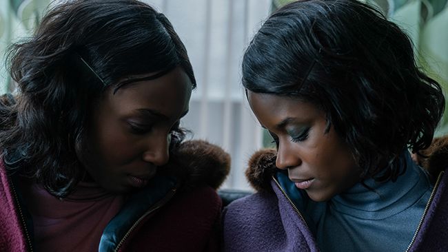 Letitia Wright and Tamara Lawrence look at each other in Silent Twins film
