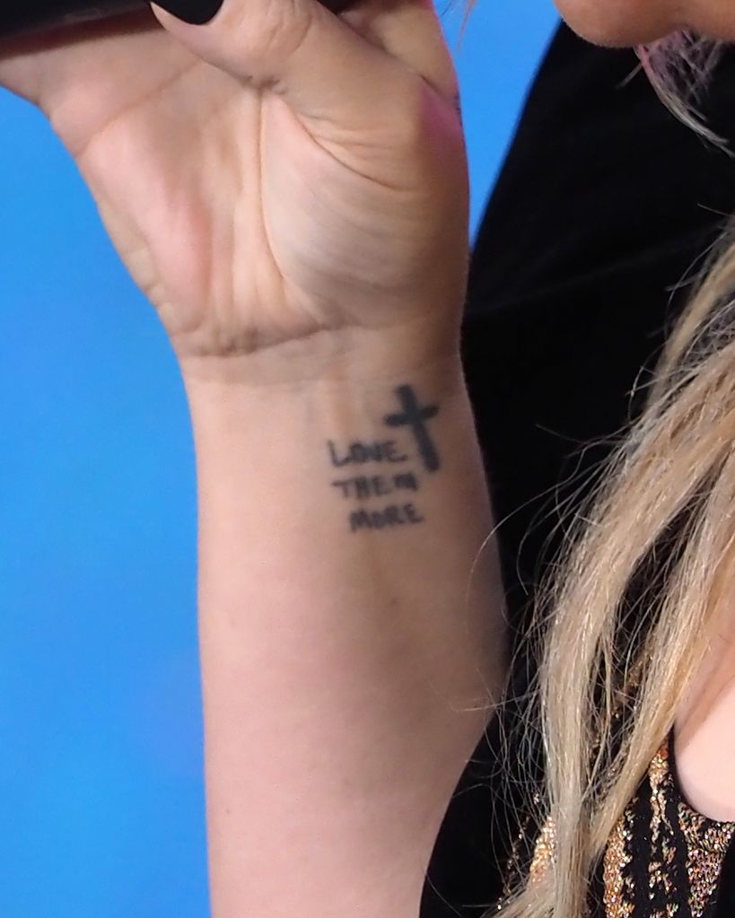 Kelly has a total of 14 tattoos 