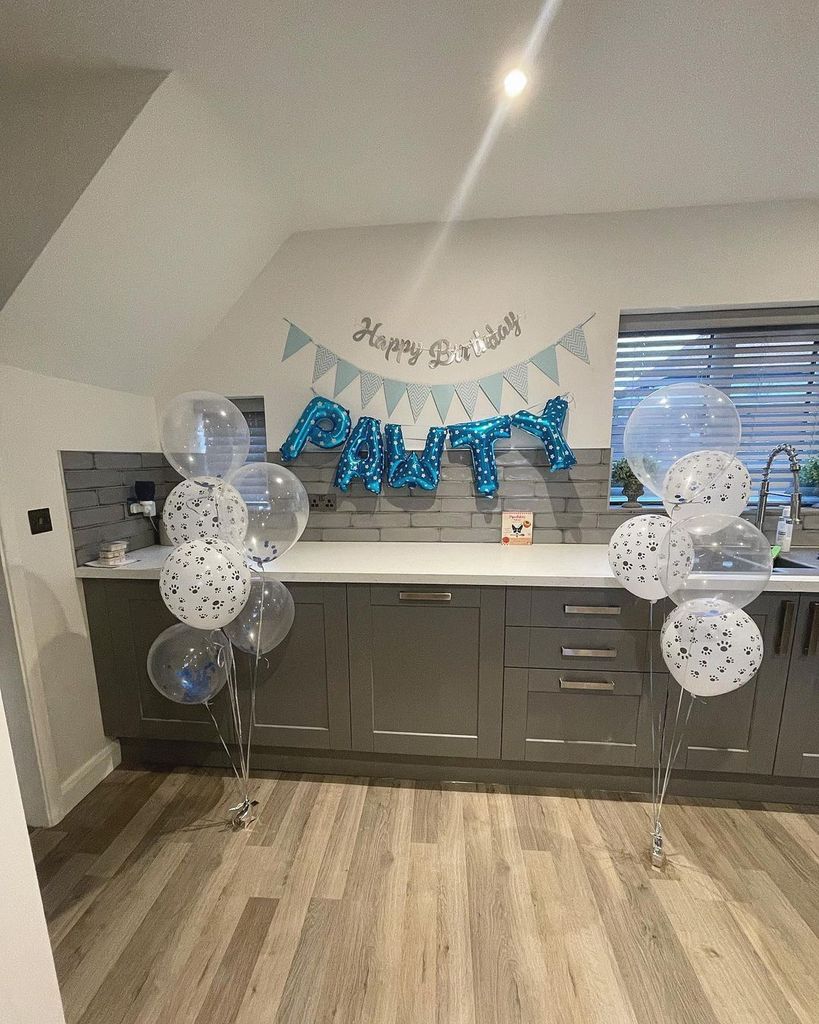 Georgia Bell's grey kitchen with 'pawty' blue balloons