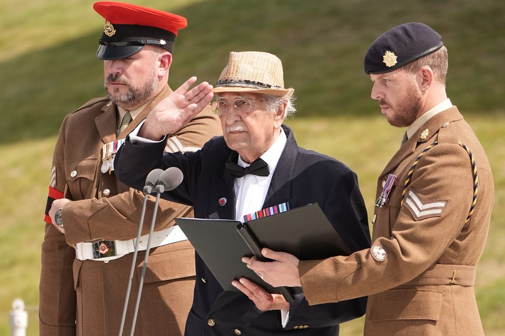 Veteran Yavar Abbas gestures as he reads from his diaries during the Service of Remembranc