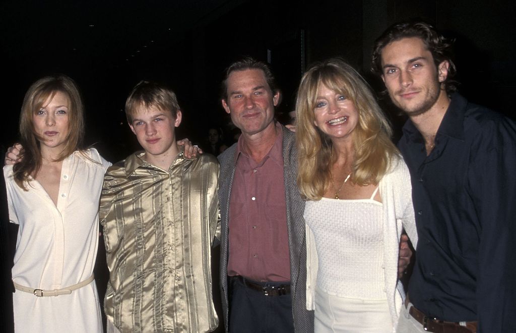 Musician Chris Robinson of the Black Crows, actress Kate Hudson, Wyatt Russell, actor Kurt Russell, actress Goldie Hawn and actor Oliver Hudson attend the Hollywood Women's Press Club's 60th Annual Golden Apple Awards on December 10, 2000 at Beverly Hilton Hotel in Beverly Hills, California
