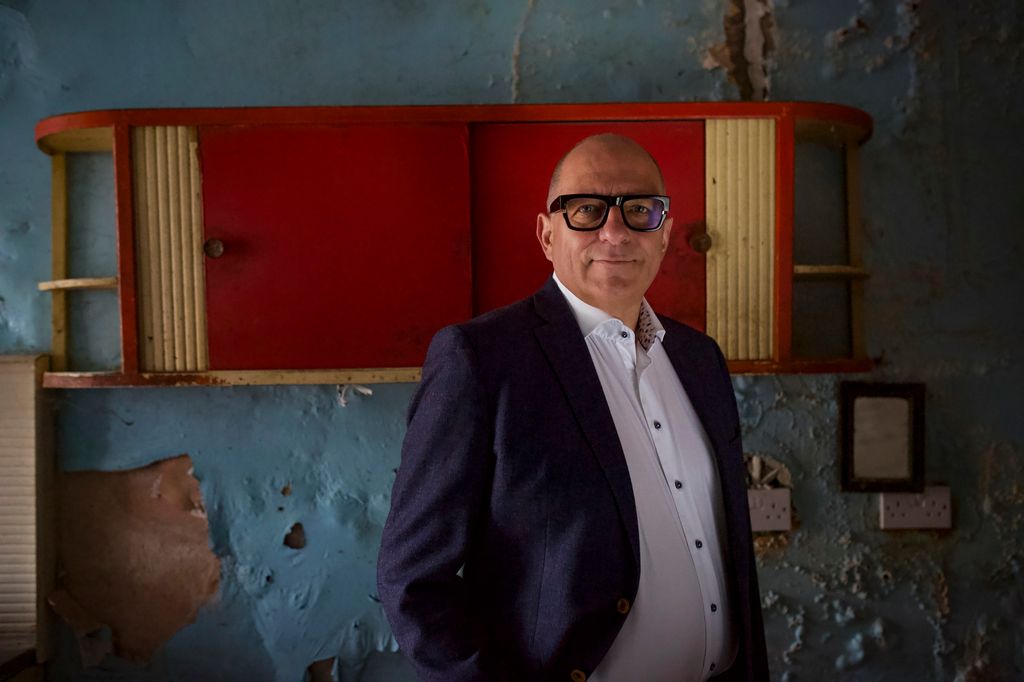 Hugh inside Rob's home