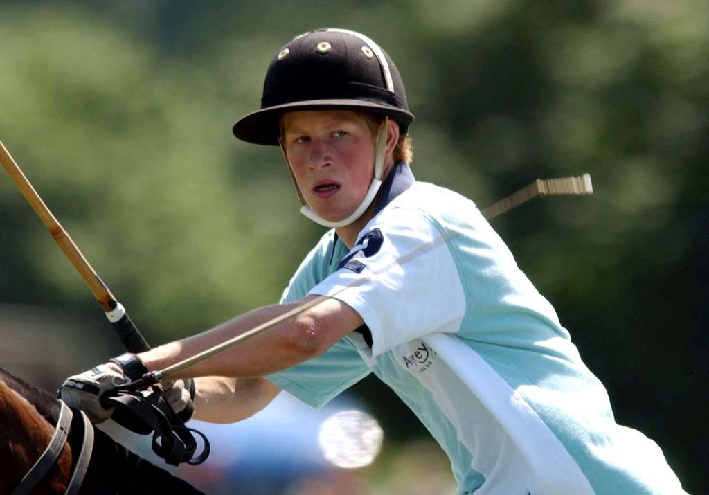 Prince Harry in action for Eton against Marlborough during The National Schools Polo Tournament