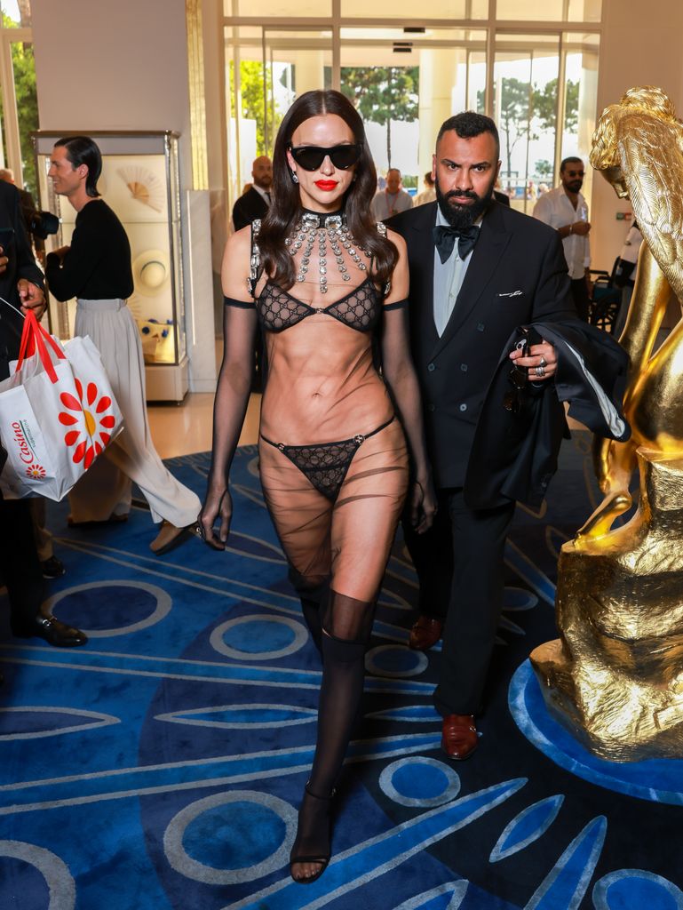 irina shayk wearing lingerie walking through hotel lobby cannes 