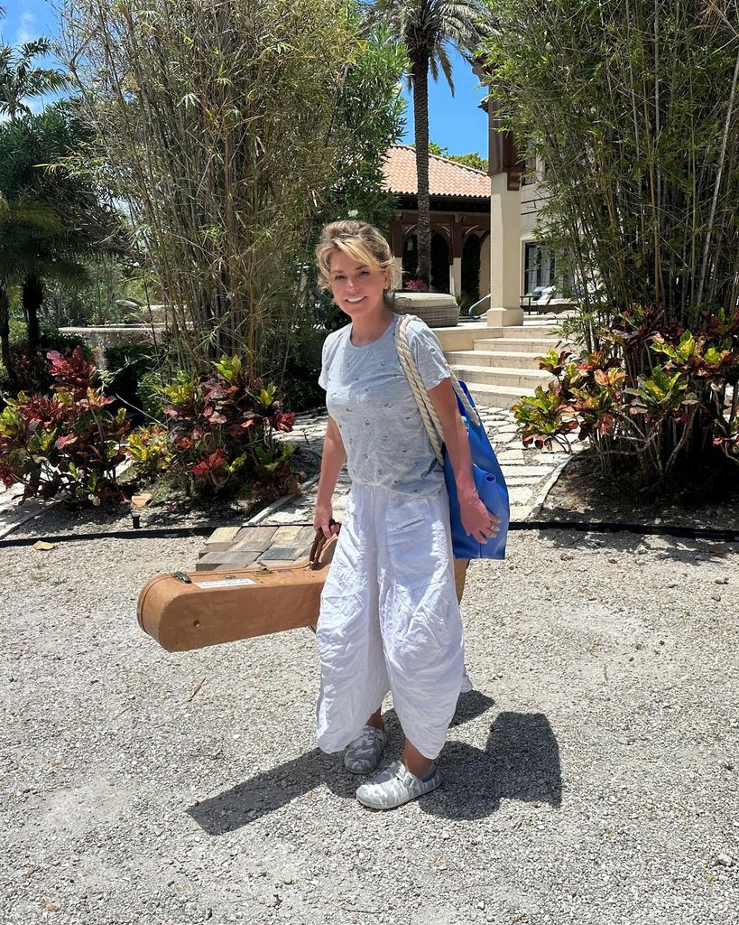 Shania Twain carrying a guitar as she leaves her holiday home 