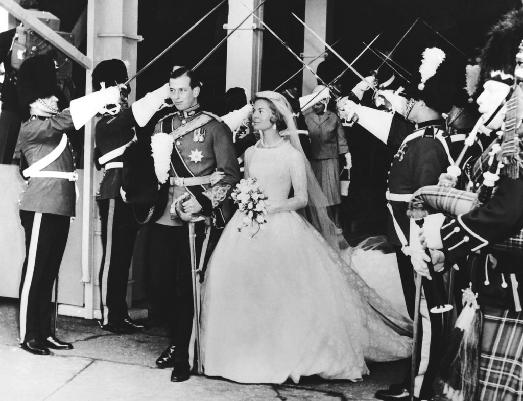 duke of Kent with Katharine Worsley under the archway of swords held by officers