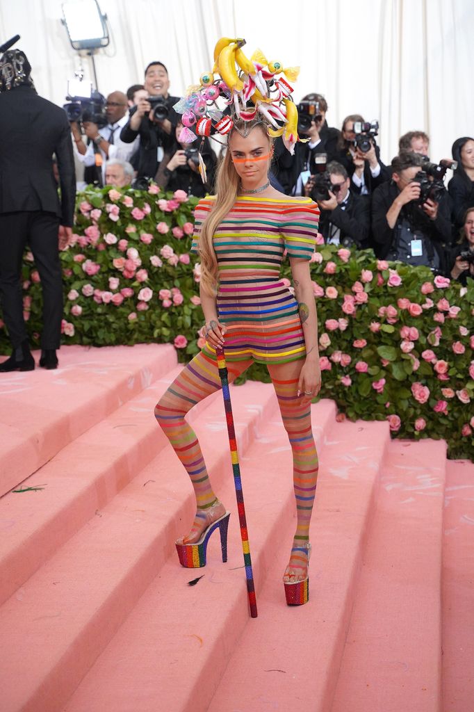 Cara Delevingne attends The Metropolitan Museum Of Art's 2019 Costume Institute Benefit "Camp: Notes On Fashion" at Metropolitan Museum of Art in rainbow dior look