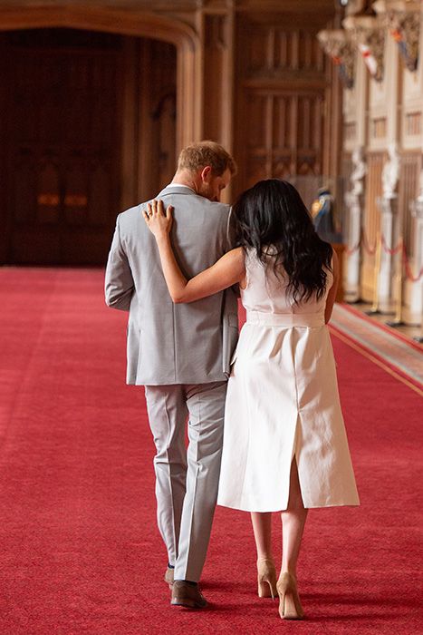 prince harry and meghan arms wrapped
