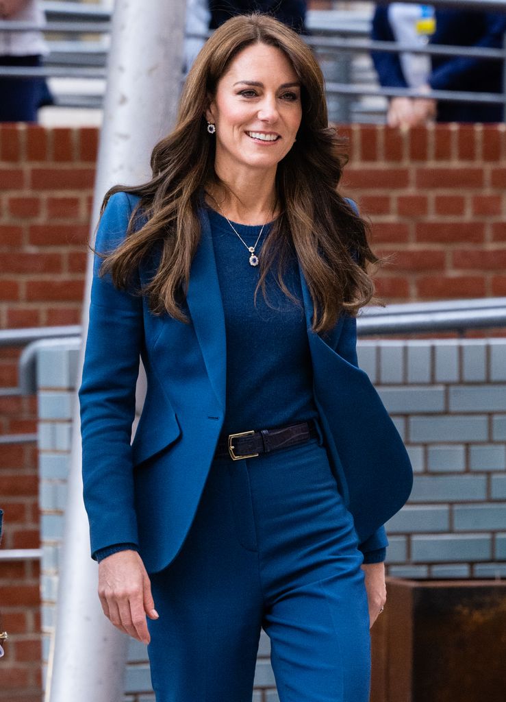 Kate Middleton wearing a French navy suit by Sarah Burton for Alexander McQueen 