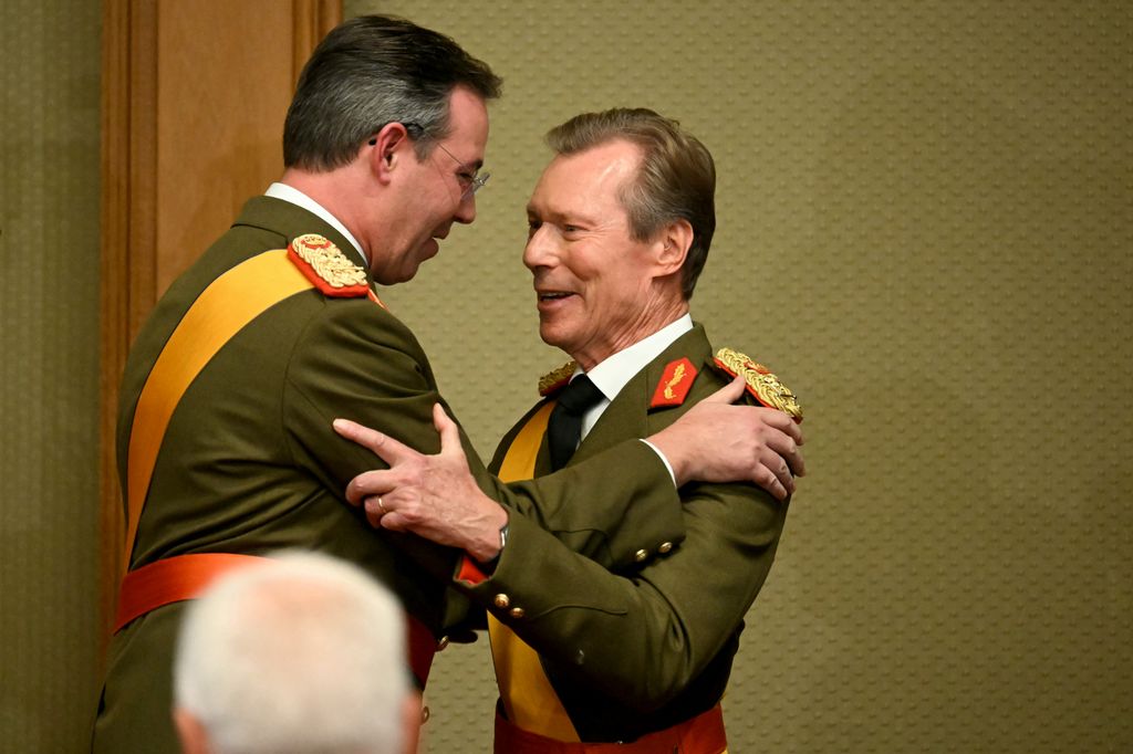 Luxembourg's Grand Duke Guillaume is congratulated by his father Grand Duke Henri