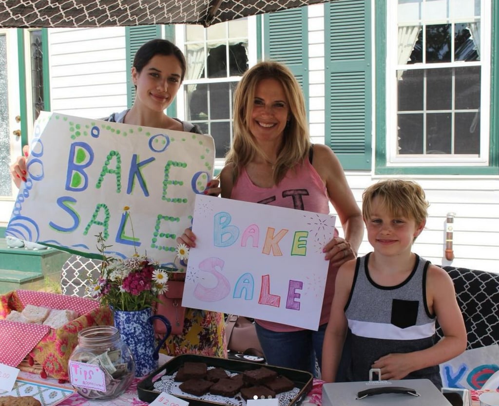 Photo shared by John Travolta on Instagram in honor of Mother's Day 2024 of his late wife Kelly Preston with their kids Ella and Benjamin during a bake sale