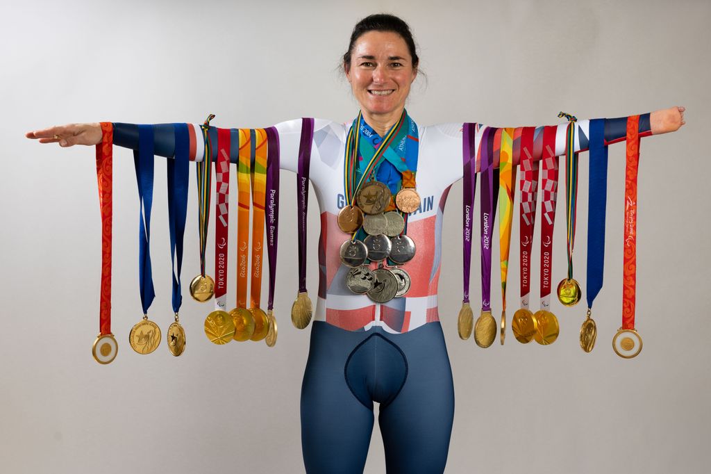 Dame Sarah Storey poses with  her 28 Paralympic medals on June 19, 2024 in Disley, England. Dame Sarah Storey is the most successful British Paralympic athlete of all time with 28 medals including 17 gold, 8 silver and 3 bronze. At the age of 14 Sarah made her maiden Paralympic appearance competing as a swimmer in Barcelona, switching to cycling in 2005. At the age of 46 Paris will be her 9th Paralympic games.