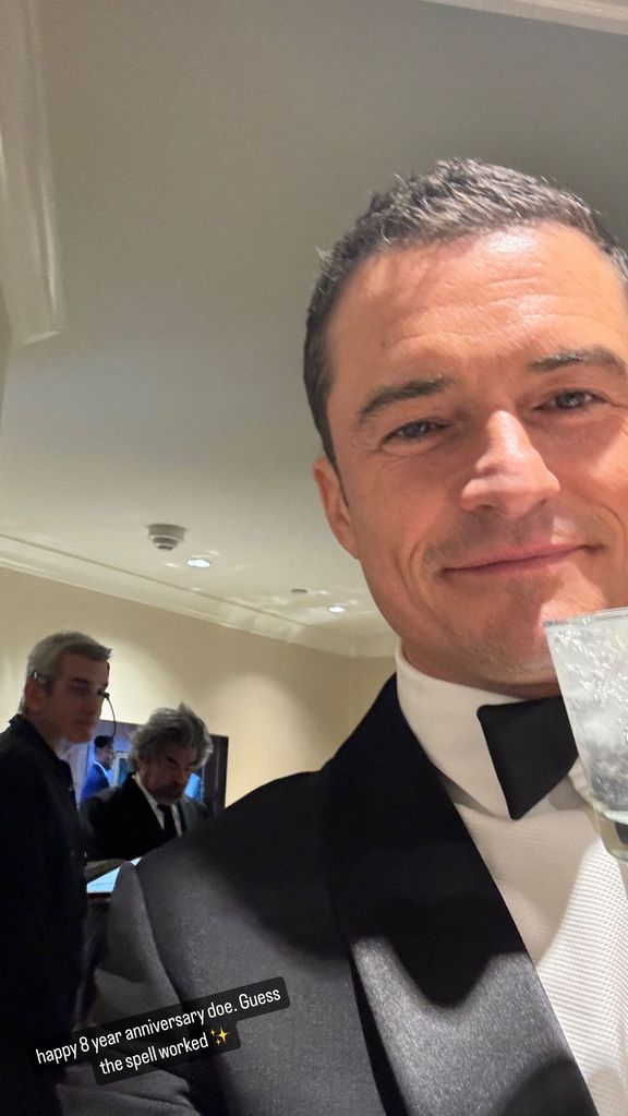 Katy Perry shares a photo of Orlando Bloom celebrating their anniversary while he attends the Golden Globe Awards