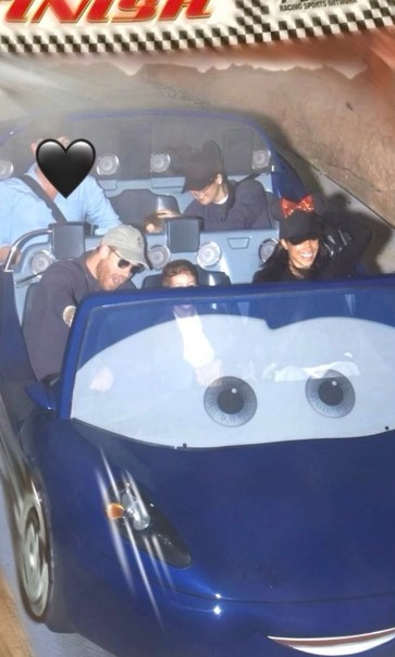 blue car ride with people smiling 