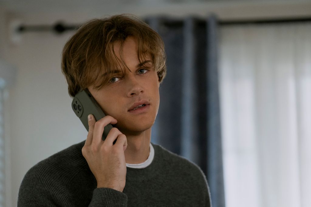 close-up of young man talking on phone
