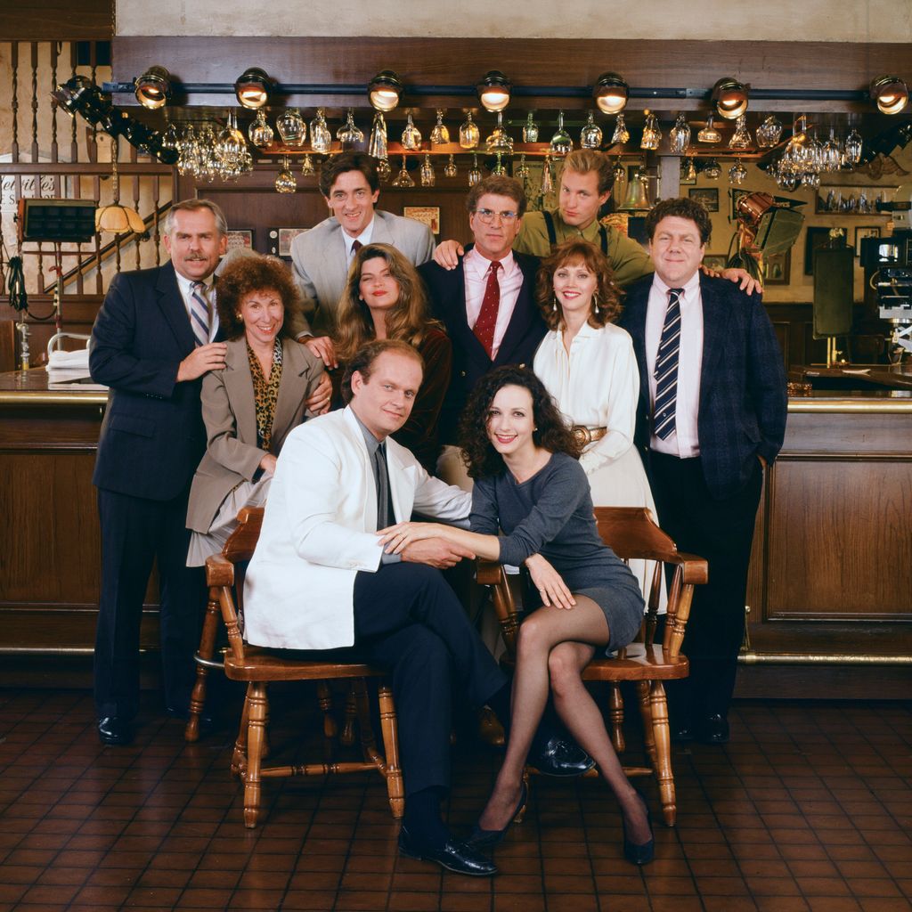 CHEERS -- Pictured: (l-r) John Ratzenberger as Cliff Clavin, Rhea Perlman as Carla LeBec, Roger Rees as Robin Colcord, Kirstie Alley as Rebecca Howe, Kelsey Grammer as Dr. Frasier Crane, Ted Danson as Sam Malone, Bebe Neuwirth as Dr. Lilith Sternin-Crane, Shelley Long as Diane Chambers, Woody Harrelson as Woody Boyd, George Wendt as Norm Peterson  (Photo by NBCU Photo Bank/NBCUniversal via Getty Images via Getty Images)