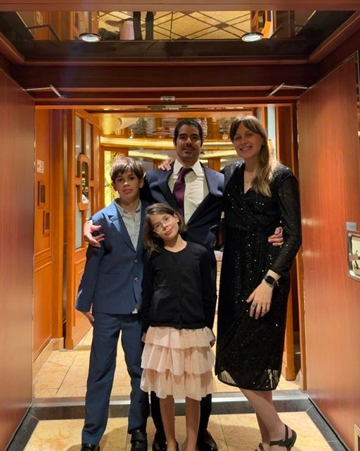 Family taking part in Black tie night on P&O's cruise ship Azura
