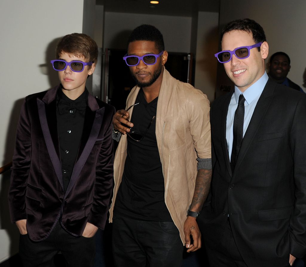 LOS ANGELES, CA - FEBRUARY 08:  Producer Usher, singer Justin Bieber, and manager Scooter Braun arrive at the premiere of Paramount Pictures' "Justin Bieber: Never Say Never" held at Nokia Theater L.A. Live on February 8, 2011 in Los Angeles, California.  (Photo by Kevin Winter/Getty Images)