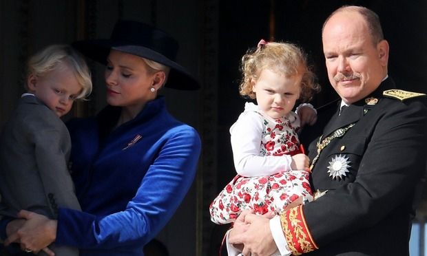 As their parents held them, the little royals seemed to get sleepy Photo: