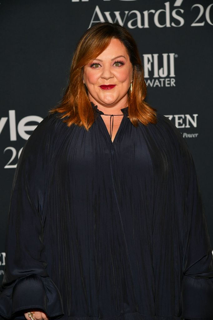 Melissa wearing a black dress in 2021