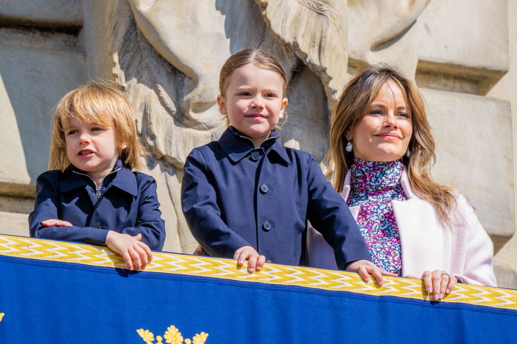 Princess Sofia in a floral dress with Prince Alexander in a blue coat