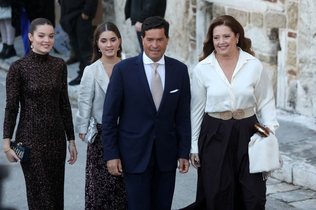 Princess Alexia of Greece (R) and Carlos Morales Quintana with their daughters arrive for the wedding of Nikolaos De Grece with Chrysi Vardinogianni at the Church of Agios Nikolaos Rangavas in Athens