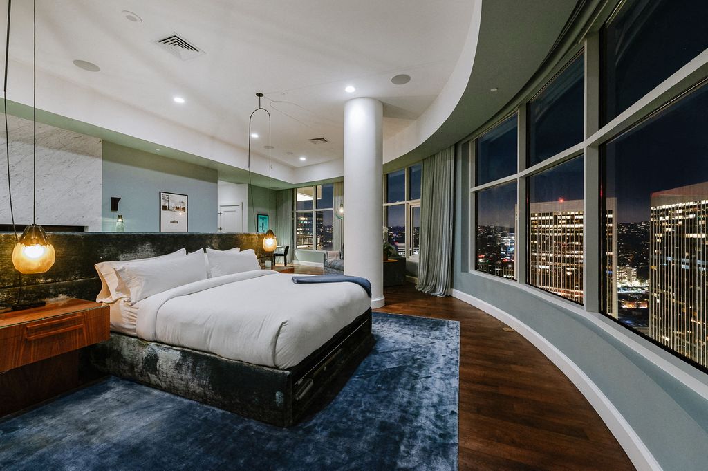Rihanna has put her luxury LA penthouse at The Century skyscraper - formerly owned by Matthew Perry - back on the market for $25 million just a year after buying it. Pictured: presumably master bedroom.