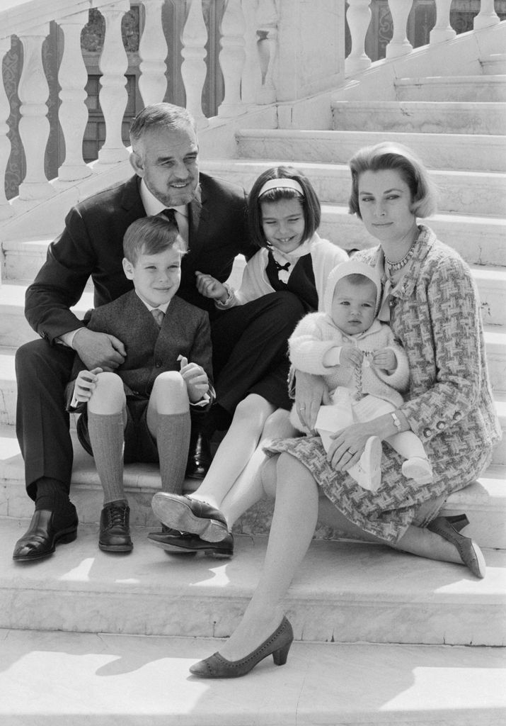 Prince Rainier and Princess of Monaco pose on the steps of the palace with their children: Princess Stephanie , 14 months; Princess Caroline, 9; and Prince Albert, 8