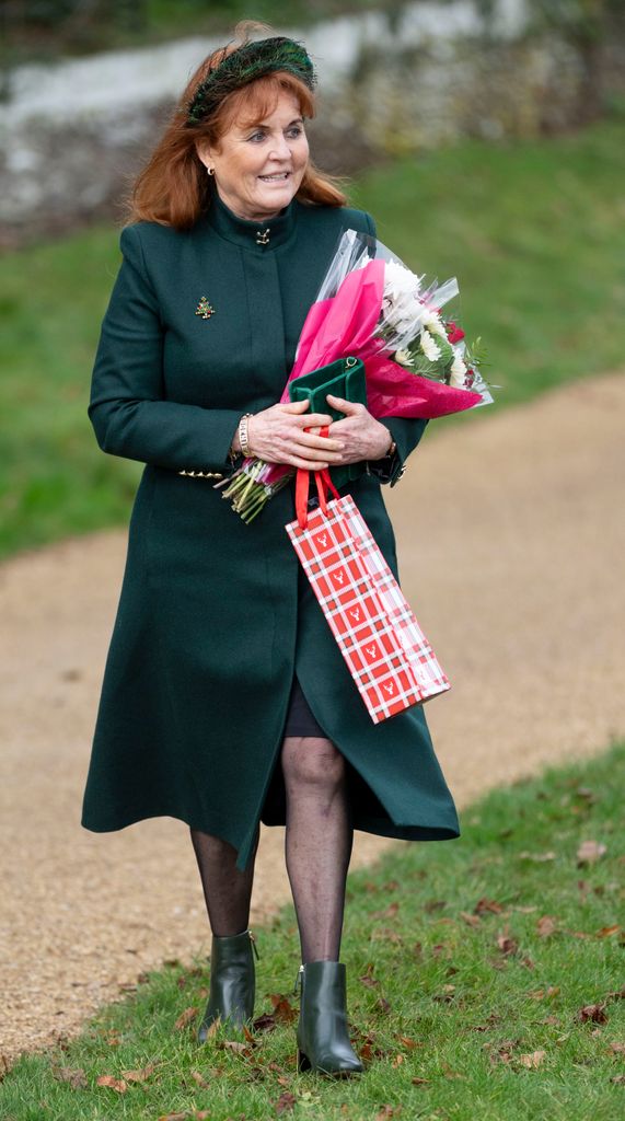 Sarah Ferguson wearing a green coat and holding flowers on Christmas Day