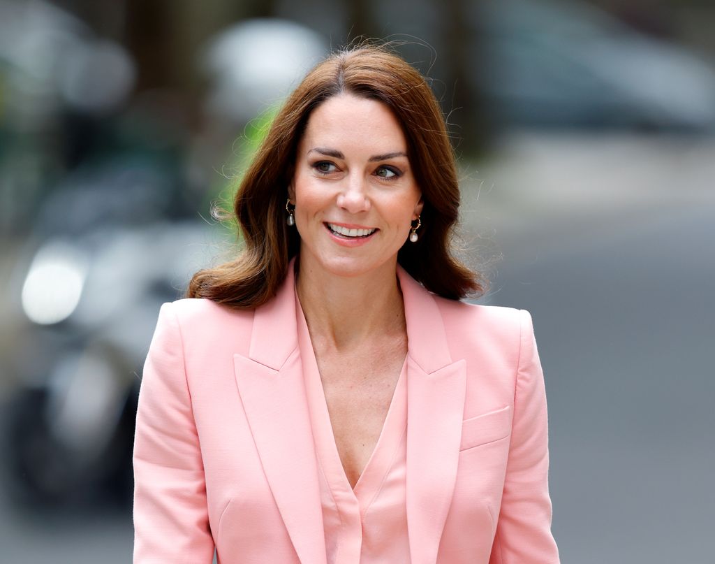 Kate Middleton wearing pink trouser suit