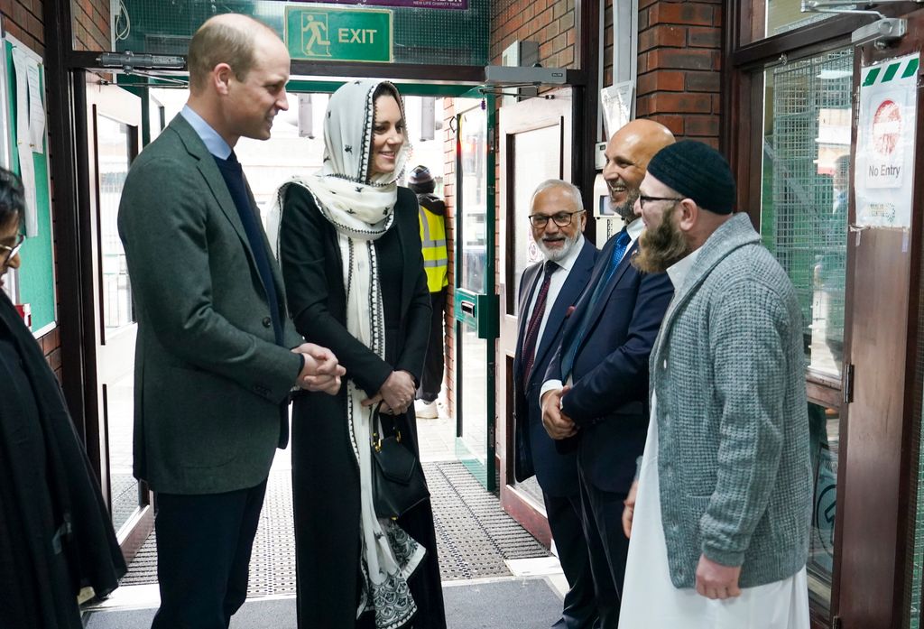 Kate Middleton and Prince William, Prince of Wales are welcomed by are welcomed by the Iman Sufyan Iqbal as they visit Hayes Muslim Centre on March 9, 2023 in Hayes, England. 