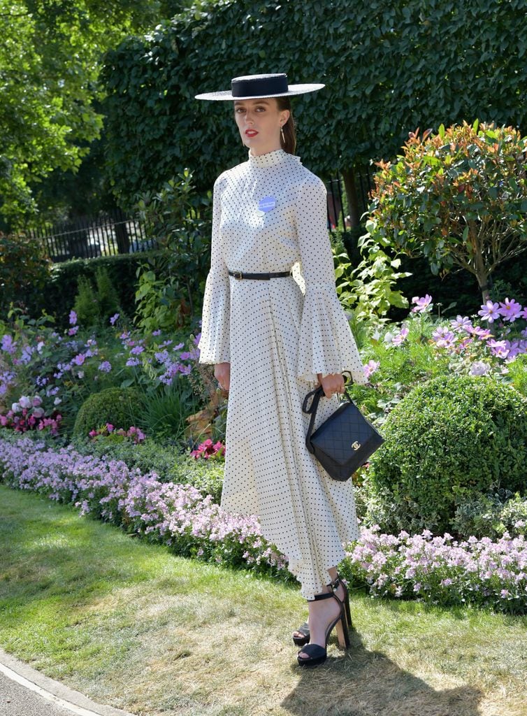 Lady Alice Manners wearing a vintage-inspired polka-dot dress and black boater hat at Royal Ascot.