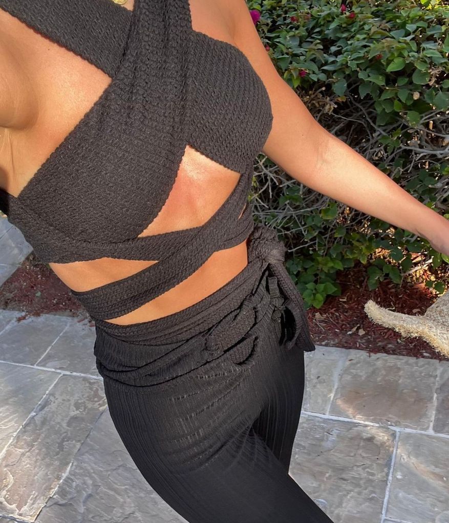 Michelle Keegan wearing a black bikini by her own brand Orfila Bee