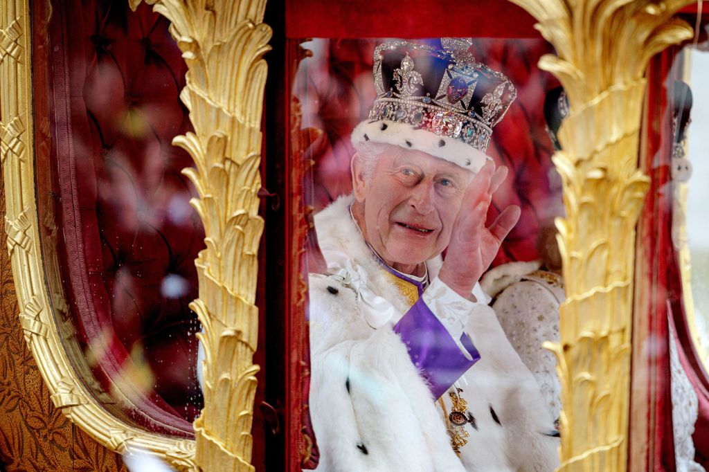 King Charles waving to crowds