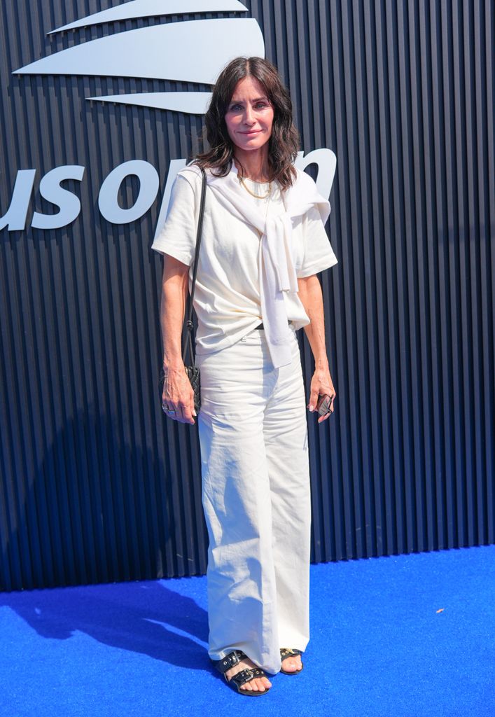 Courteney cox in white jeans and tee