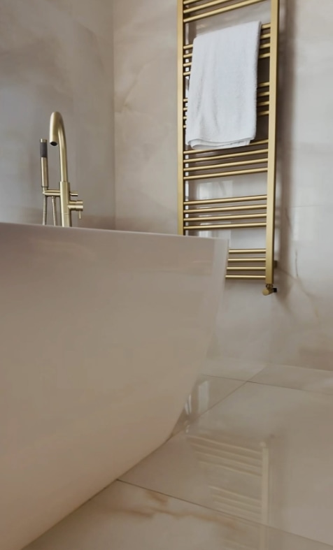 Mark and Michelle's stunning bathroom with marble and gold detailing