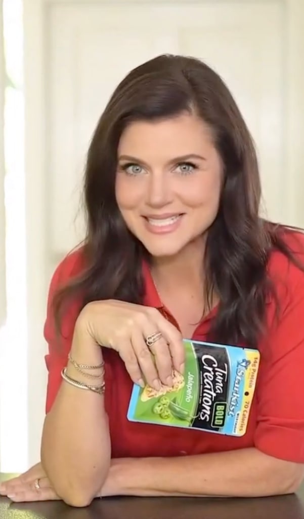 tiffani thiessen red blouse talking to camera