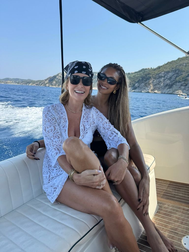 Amanda and Alesha smiling on boat on sea