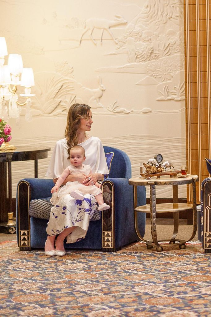 Princess Rajwa holding daughter Princess Iman in Bahrain