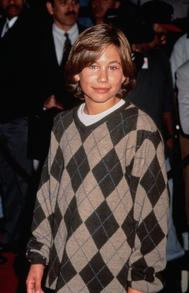 Jonathan Taylor Thomas, wearing a diamond-pattern sweater