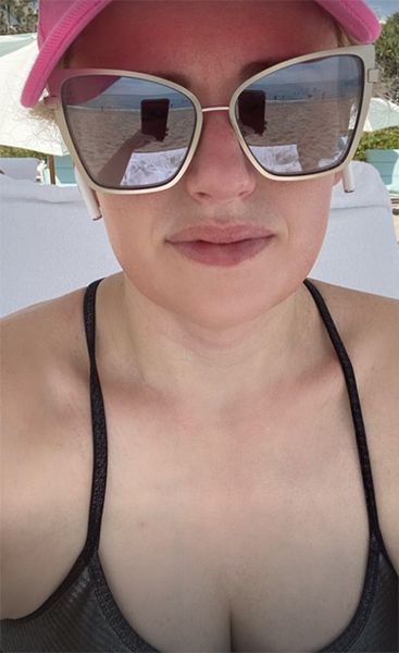 rebel wilson black swimsuit beach selfie