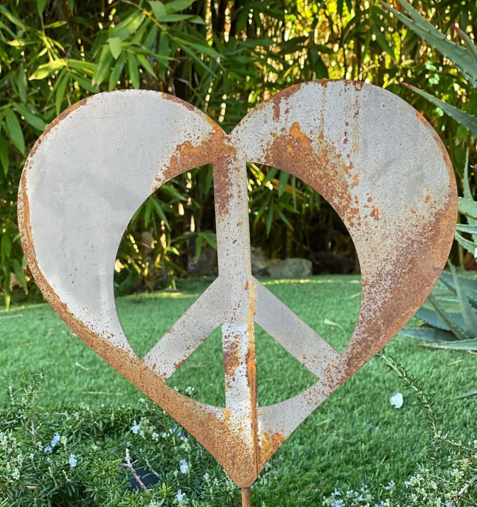 ringo starr's garden with metal peace sign 