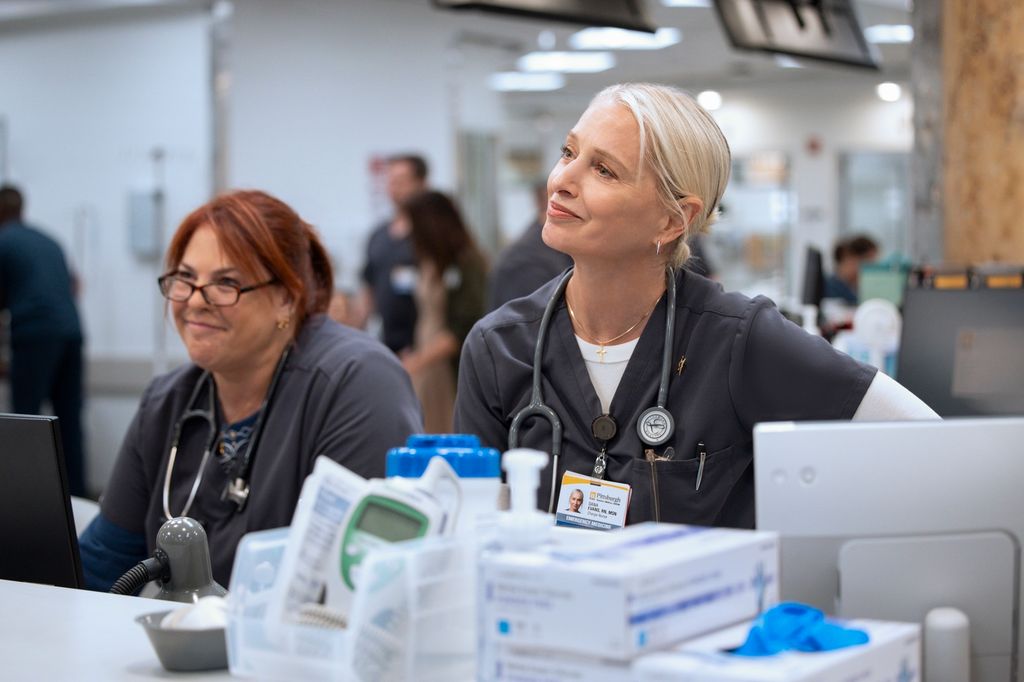 Charge nurses Dana (R) and Lena at the desk in a still from The Pitt