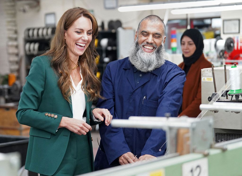 Princess Kate laughs and chats during a visit to AW Hainsworth